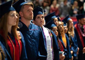 Students in graduation caps and robs at commencement